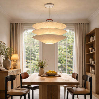 A modern three-tiered pendant chandelier with a warm