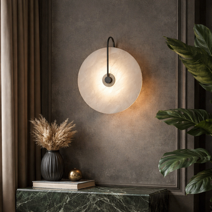 A modern circular wall sconce