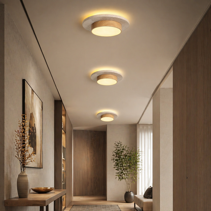 Three modern flush-mount ceiling lights with circular white and light wood shades