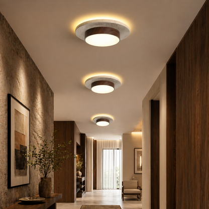 Three modern flush-mount ceiling lights with warm white LED illumination and circular wood accents
