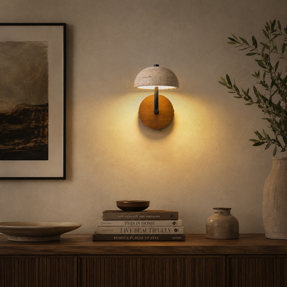 A warm wall-mounted sconce with a textured stone-look dome shade
