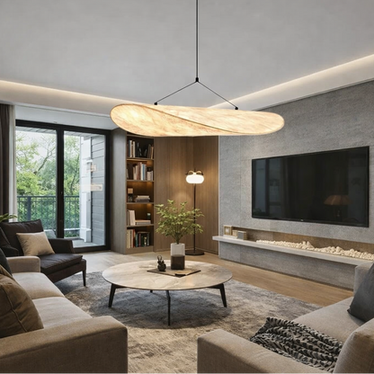 A modern living room featuring a large, organic-shaped pendant light