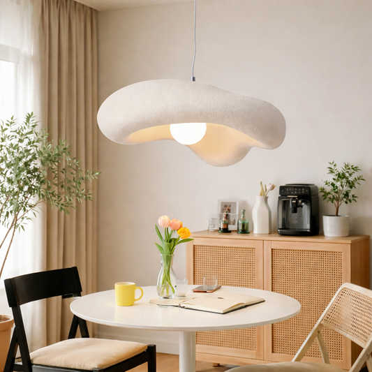 A modern wavy pendant light with a textured off-white felt-like finish