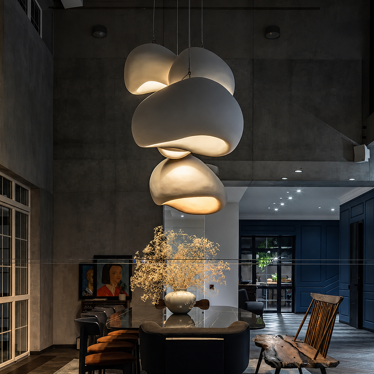 A modern multi-light pendant chandelier with organic, cloud-like white shades