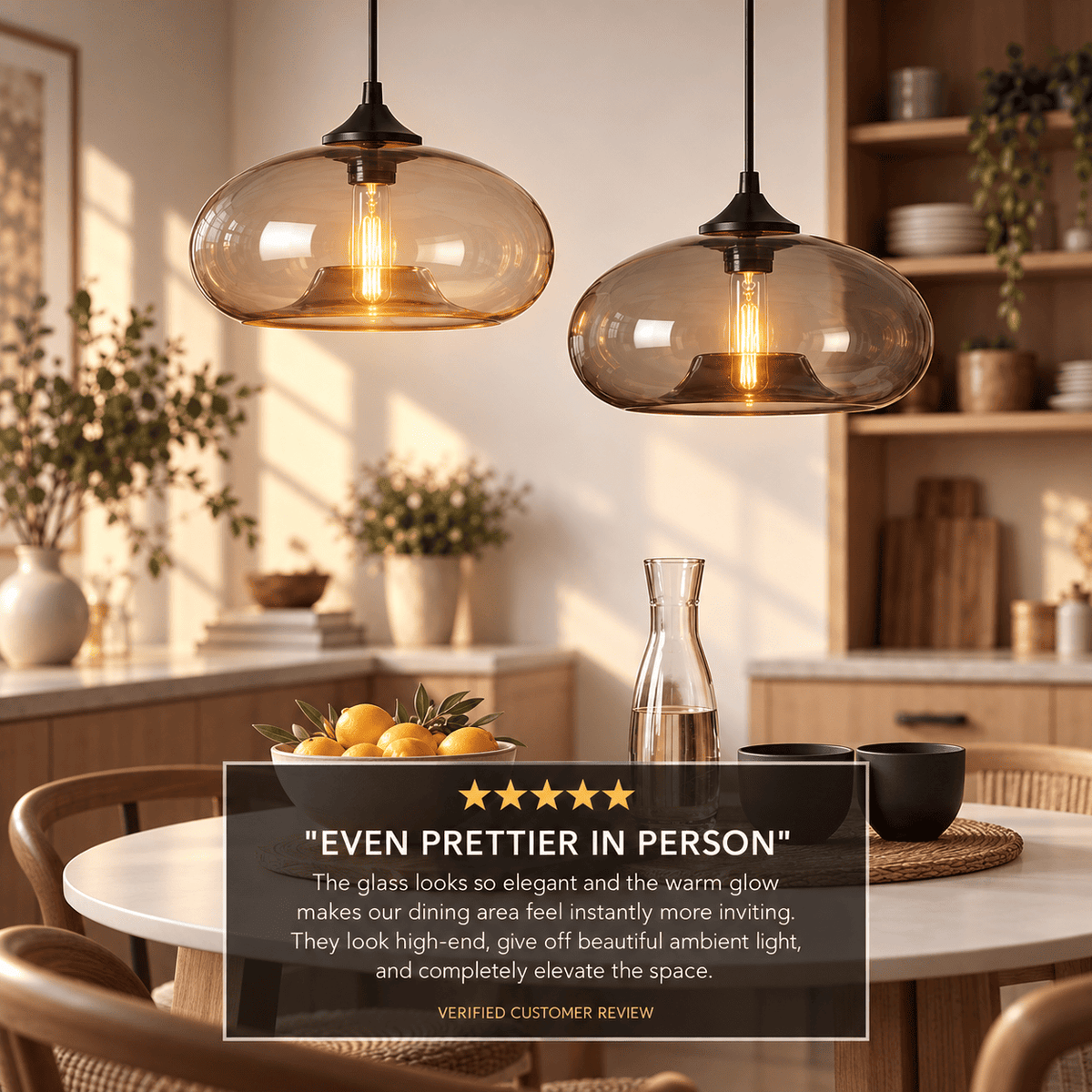Two amber glass pendant lights hanging over a dining table