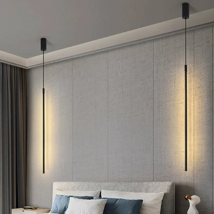 Modern bedroom with gray textured wall, bed, and pendant lights