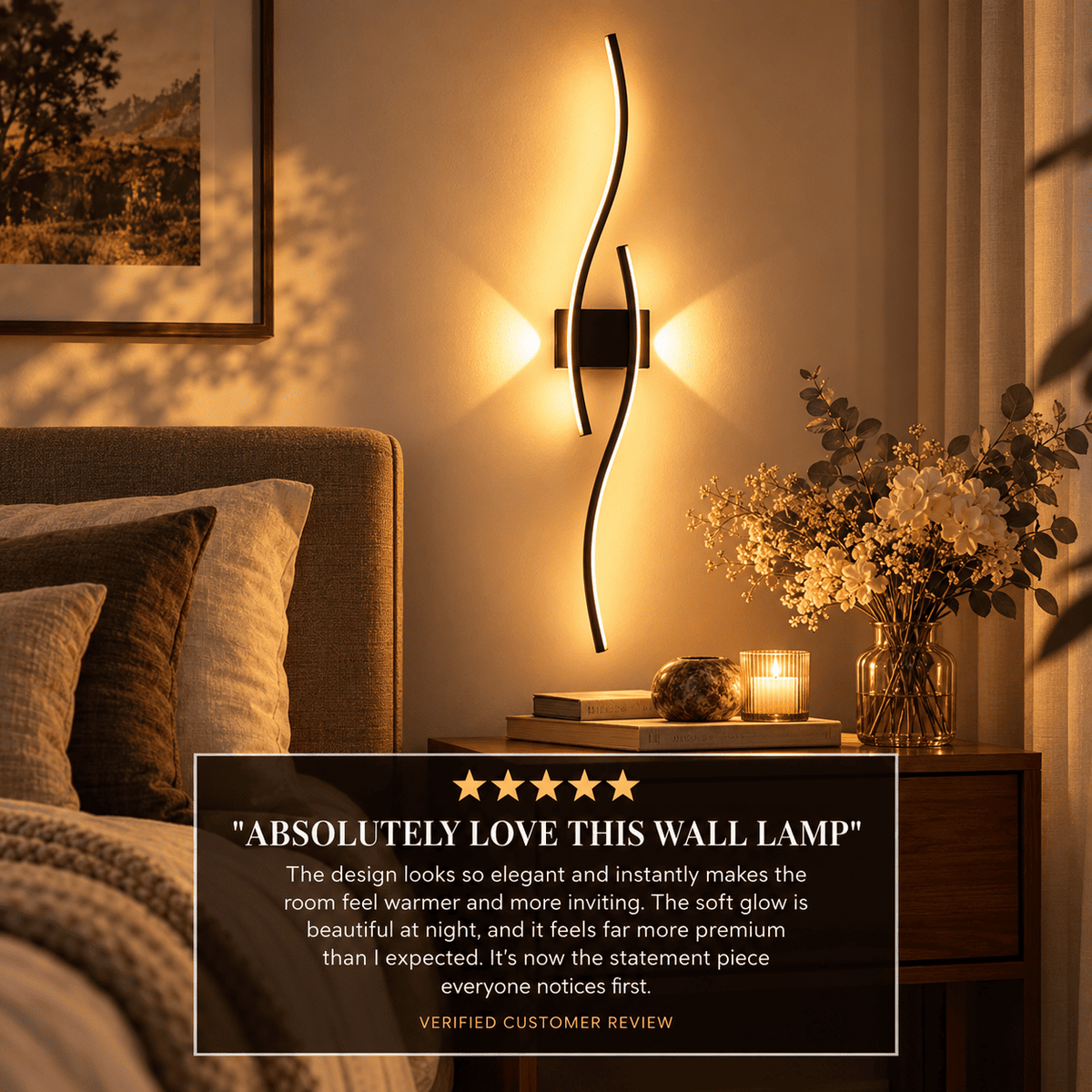 A modern black wavy wall sconce mounted on a warm beige wall in a styled bedroom setting