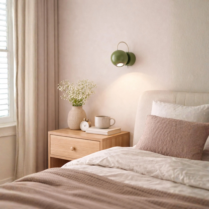 A green sphere wall sconce